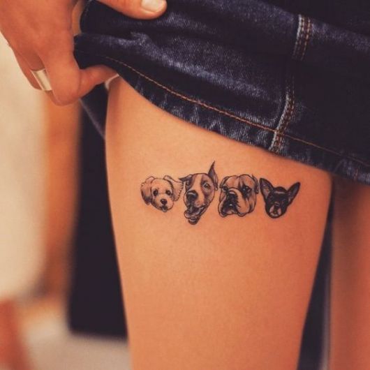 tatuagem feminina de animais na coxa