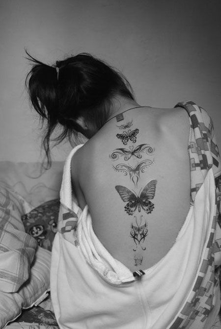 tatuagem nas costas de borboleta